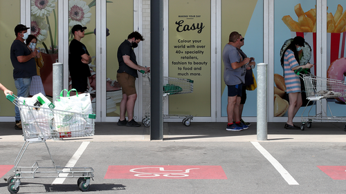 People queuing at Woolworths at West Torrens on November 18, 2020 in Adelaide, Australia after the six day lockdown was announced. 