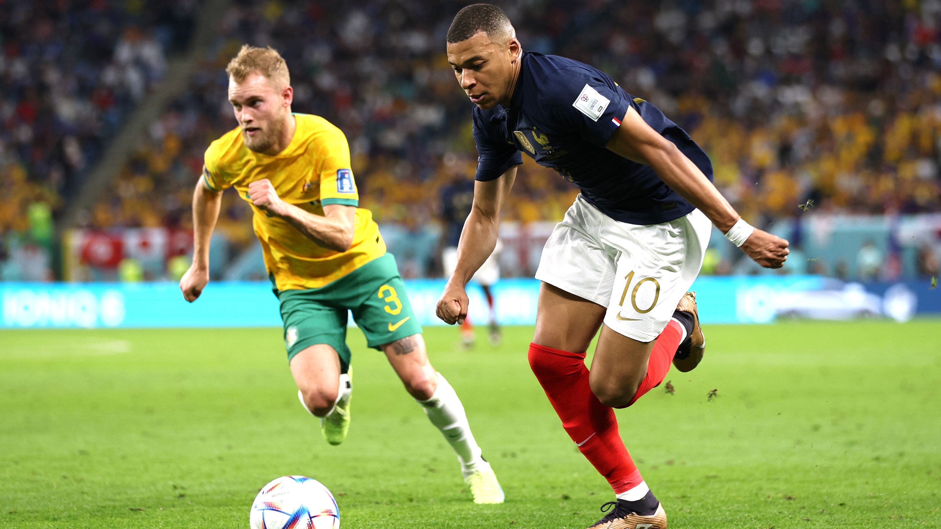 Kylian Mbappe of France controls the ball against Nathaniel Atkinson of Australia.