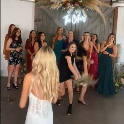 Wedding guest viciously rips the bouquet from another woman's hand