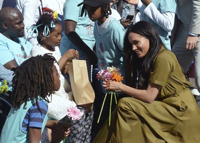 Prince Harry, and his wife, Meghan, the Duchess of Sussex, during a walkabout in Bo-Kaap, a heritage site, in Cape Town, South Africa, Tuesday, Sept, 24, 2019.  