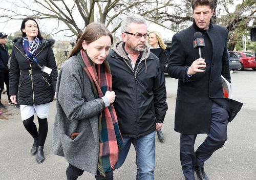 The only daughter of Karen Ristevski, Sarah, leaves a press conference with her father after pleading for  information to help find her missing mum. Picture: AAP