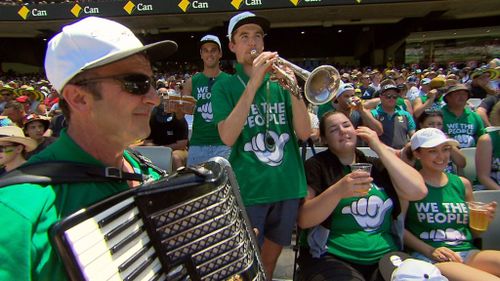 Revellers rousing the crowd with a musical rendition. (A Current Affair)