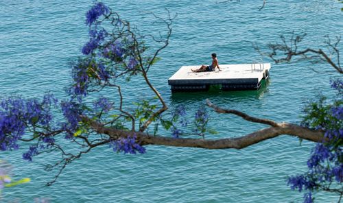 People brave the early morning ahead of the record-breaking heat at Redleaf Pool, Rose Bay, in Sydney, Wednesday, 22 October 2025. Total fire bans in place across NSW amid forecasts of record-breaking heat, extreme fire danger and dangerous winds.