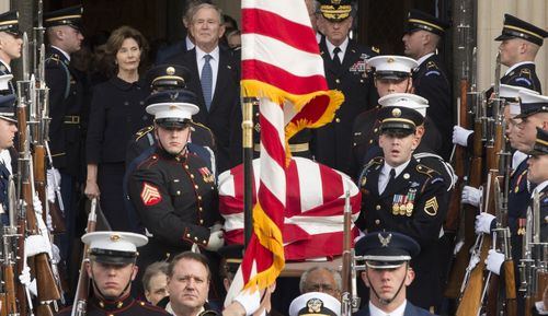 The coffin leaves Washington's National Cathedral after the funeral.