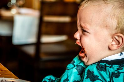 Baby boy crying in an expensive restaurant