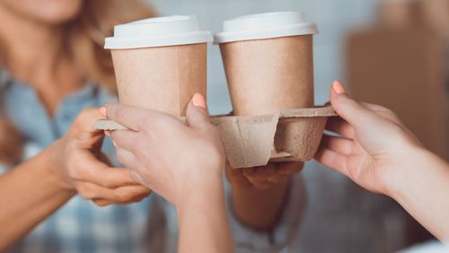 Woman buying takeaway coffee