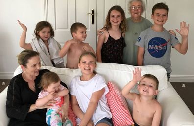 Betty with granddaughter Corrie and seven of her great-grandchildren.
