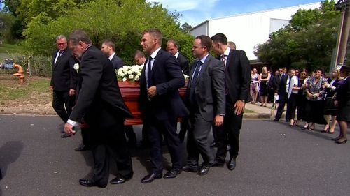 Pall bearers Greg and Jason Hughes, Michael Clarke, Corey Ireland, Mitchell Lonergan, Matthew Day, Aaron Finch and Tom Cooper. (9NEWS)