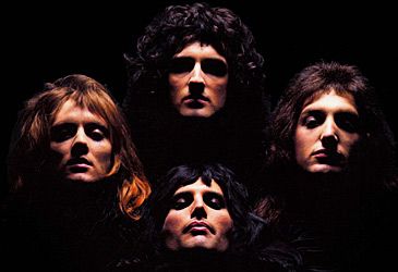 Which original member of Queen has a PhD in astrophysics?