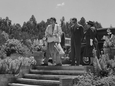 Princess Elizabeth and Prince Philip arrive at Sagana Lodge in Nyeri County, during a Commonwealth visit to Kenya, 5th February 1952. With them are Sir Philip Mitchell, Governor of Kenya (behind the princess) and his wife Margery Tyrwhitt-Drake (right). The following day, during a walk in the grounds on the royal couple's return to the lodge from the Treetops Hotel, Prince Philip would break the news to Elizabeth that her father, King George VI, had died during the night and that she had acceded