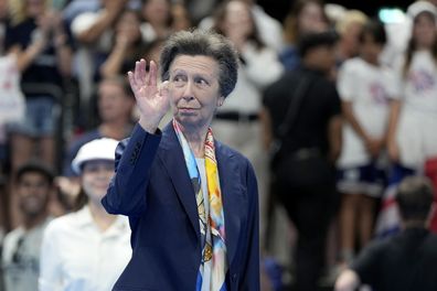 Britain's Princess Anne waves as she leaves the pool deck after presenting the medals for the men's 100-meter breaststroke final at the 2024 Summer Olympics, Sunday, July 28, 2024, in Nanterre, France. 