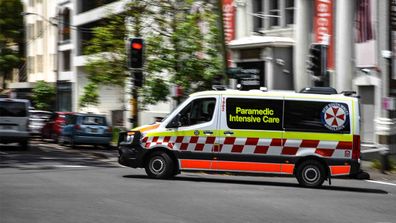 Ambulances leave the emergency bay at St Vincent's Hospital in Darlinghurst, Sydney.