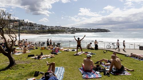 People enjoy the sunshine on the Labour Day long weekend public holiday at Bronte Beach, Sydney, Monday October 3, 2022. 