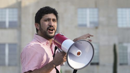 U.S. Rep. Greg Casar speaks during a march with striking YouTube Music workers to Google offices in downtown Austin, Texas, on Tuesday, Feb. 21, 2023. About 30 workers and their supporters formed a picket line in front of the Google offices and rallied against alleged union-busting. The workers have been on an unfair labor practice strike since Feb. 3, following a mandatory return-to-office mandate they say violates status quo before a union election.