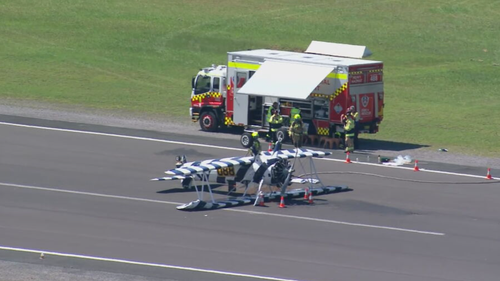 A vintage biplane has crashed at a New South Wales airport, landing upside down on the runway while attempting to touch down.