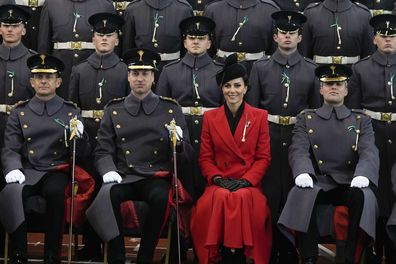 Prince William and Kate, Princess of Wales sit for an official photo with The Prince of Wales's company at a St David's Day parade with members of the 1st Battalion, The Welsh Guards in Windsor England, Wednesday, March 1, 2023. 