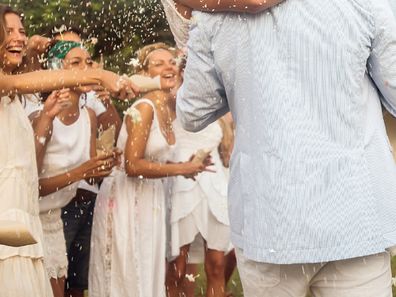 Wedding guests wearing white debate