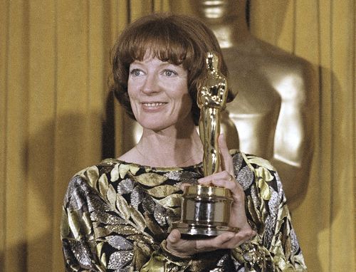 Actress Maggie Smith holds her Oscar 