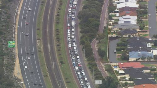 The Kwinana Freeway was closed for hours following the crash, causing traffic gridlock. Picture: 9NEWS