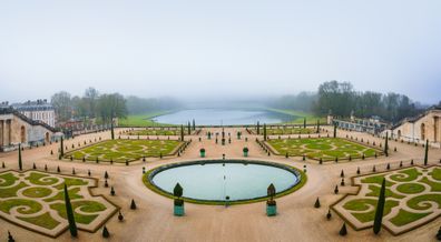 Paris, France - January 7, 2016: Gardens of Versailles Apollo Fountain. Versailles was a hunting lodge until King Louis XVI transformed it into a palace during the 17th century.