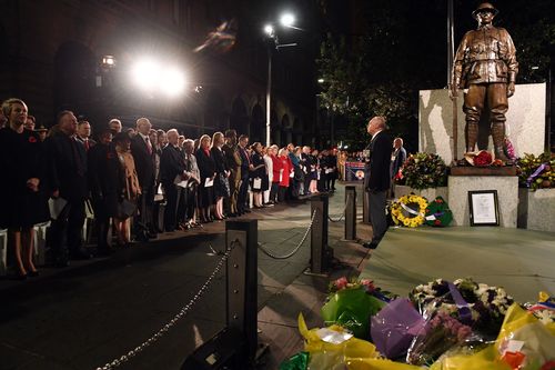 Members of the dignitary party sing the national anthem at the Cenotaph during the Anzac Day Dawn Service at Martin Place in Sydney last year. (AAP)