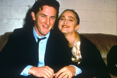 Sean Penn and Madonna relax while attending an AIDS benefit November 11, 1987 in Los Angeles. 