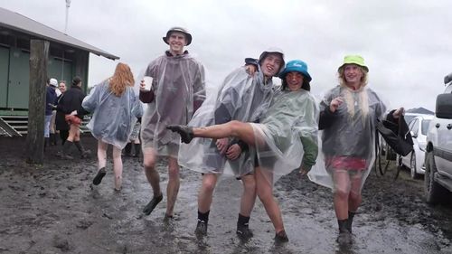 Splendour in the Grass festival goers in the rain and mud