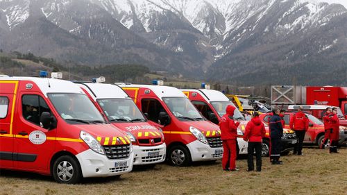Emergency vehicles are lined up near the crash site. (AAP)