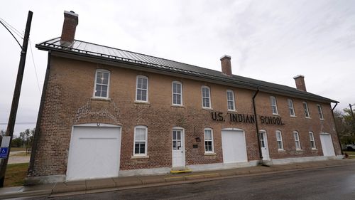 The museum building at the former Genoa Indian Industrial School is seen. For decades the location of the student cemetery, where more than 80 Native American children are buried, has been a mystery.