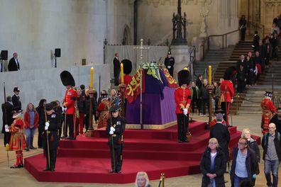 Queen Elizabeth II's grandchildren mount a family vigil over her coffin lying in state in Westminster Hall. 