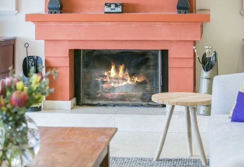 The fireplace is a nice touch for the country home. (Stayz.com.au)