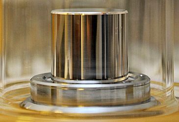 Rather than use an object, which physical constant is now used to define the kilogram?