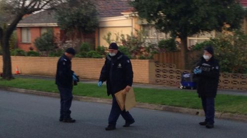 Forensic police start to bag evidence at Noble Park where a man's body has been found. (9NEWS)