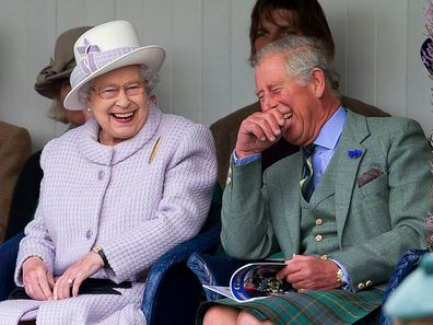 Queen Elizabeth II and Prince Charles, Prince of Wales laugh whilst watching the children's sack race as they attend the 2012 Braemar Highland Gathering at The Princess Royal & Duke of Fife Memorial Park on September 1, 2012 in Braemar, Scotland. (Photo by Indigo/Getty Images)
