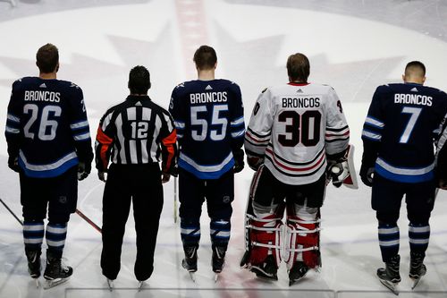 The Winnipeg Jets and the Chicago Blackhawks wore 'Broncos' on the back of their jerseys. (AP)