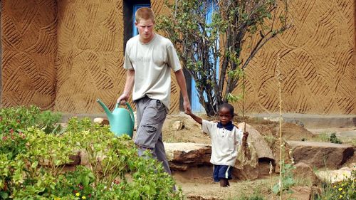 An African orphan Prince Harry befriended in 2004 was invited onto the grounds of Windsor Castle for his wedding over the weekend. Picture: AAP.