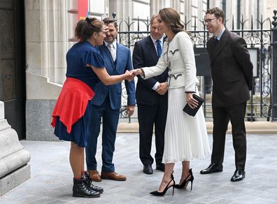 Catherine, Princess of Wales (R) shakes hands with artist Tracey Emin, who was commissioned to create an artwork for the Gallerys new doors, incorporating 45 carved brass panels, representing "every woman, throughout time", at the reopening of the National Portrait Gallery on June 20, 2023 in London 
