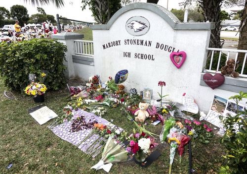 Tributes for the victims outside the Parkland, Florida high school. (EPA/AAP)