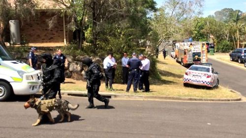 Tactical police at the scene of a siege in Collingwood Park. (9NEWS)