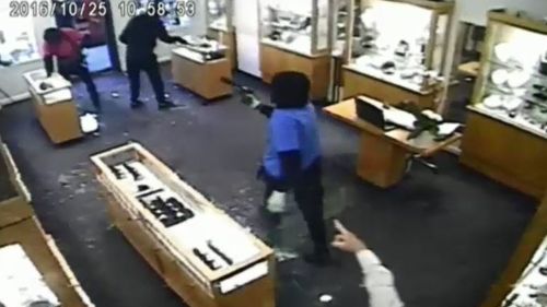 CCTV shows the masked offenders in the Toorak Road jewellery store. (9NEWS)