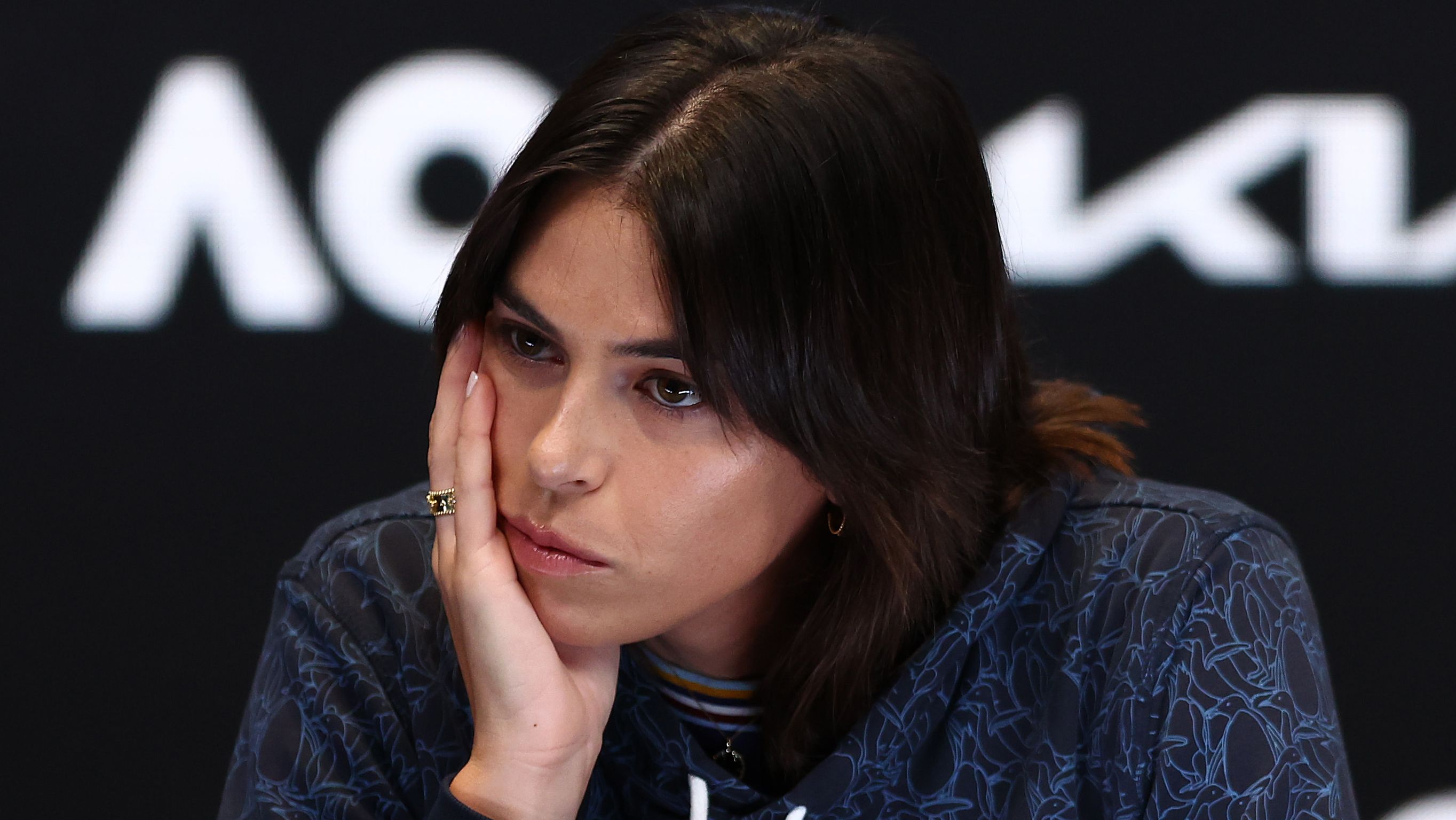 A teary Ajla Tomljanovic speaks to the media during a press conference after pulling out of the 2023 Australian Open.