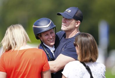 Zara Tindall hugs her husband Mike, on day two of the Badminton Horse Trials 2024 at the Badminton Estate in Badminton, England, Thursday, May 9, 2024