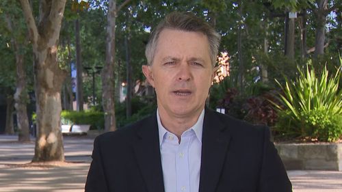 Jason Clare speaking in a park in an interview with Weekend Today.