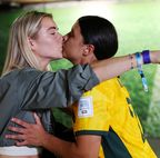 Sam Kerr of Australia celebrates with her partner Kristie Mewis of USA after her team&#x27;s victory through the penalty shoot out against France.