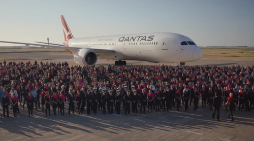 The Qantas ad used real employees for the nostalgic walk through the eras. 