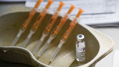 A vial and syringes of the AstraZeneca COVID-19 vaccine.