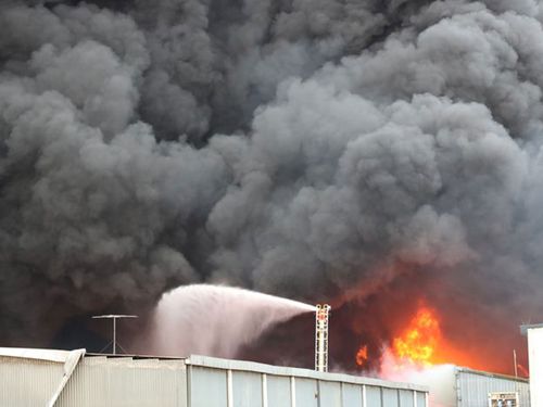 A toxic inferno has closed schools and businesses as a warehouse that caught fire in Melbourne’s suburbs sparked major health fears.
