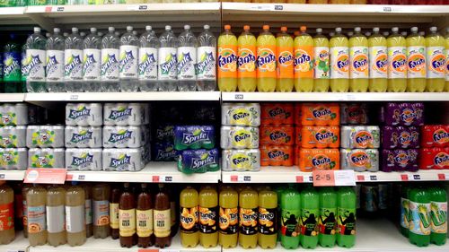 Manufacturers in the UK must pay a levy on drinks with a sugar content above five grams per 100mL – and a higher one on those containing more than eight grams. (AAP)