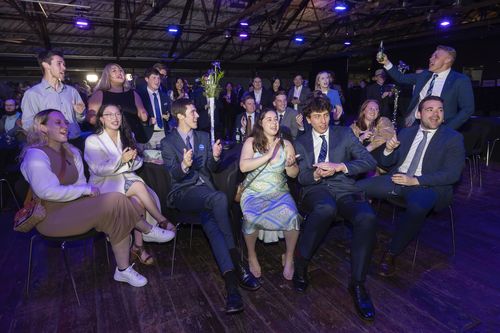 New Zealand National Party supporters cheer as preliminary results are announced at a party event in Auckland, Saturday, Oct. 14, 2023, following a general election.