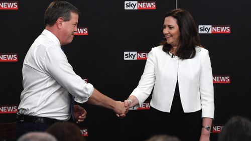 Queensland Premier Annastacia Palaszczuk shakes hands with the Leader of the Opposition Tim Nicholls during 'The People's Forum' leaders debate at the Broncos Leagues Club, Brisbane. (AAP)